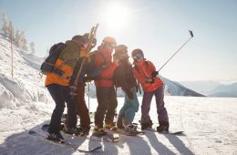 group-skiers-taking-selfie-mobile-phone_107420-96447